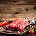 A fresh piece of raw beef on the table.