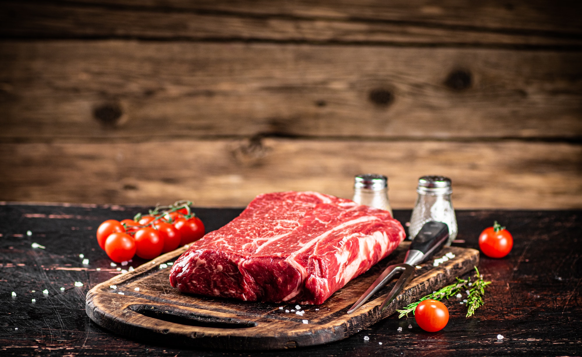 A fresh piece of raw beef on the table.