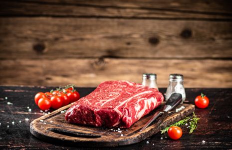 A fresh piece of raw beef on the table.