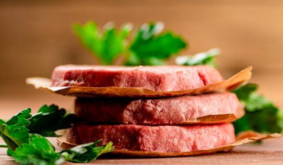 Fresh raw burger on the table.