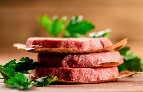 Fresh raw burger on the table.